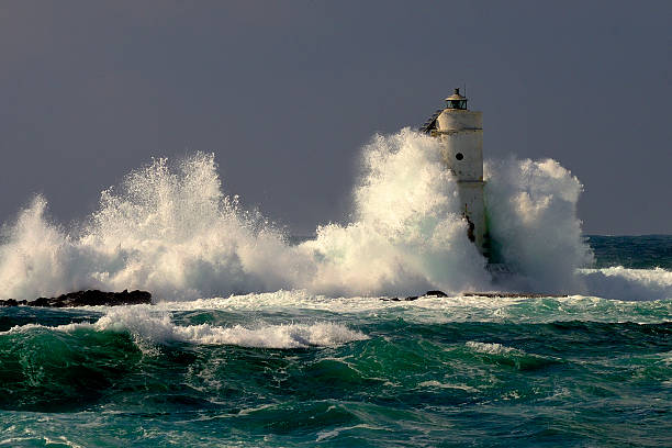 lighthouse near waves